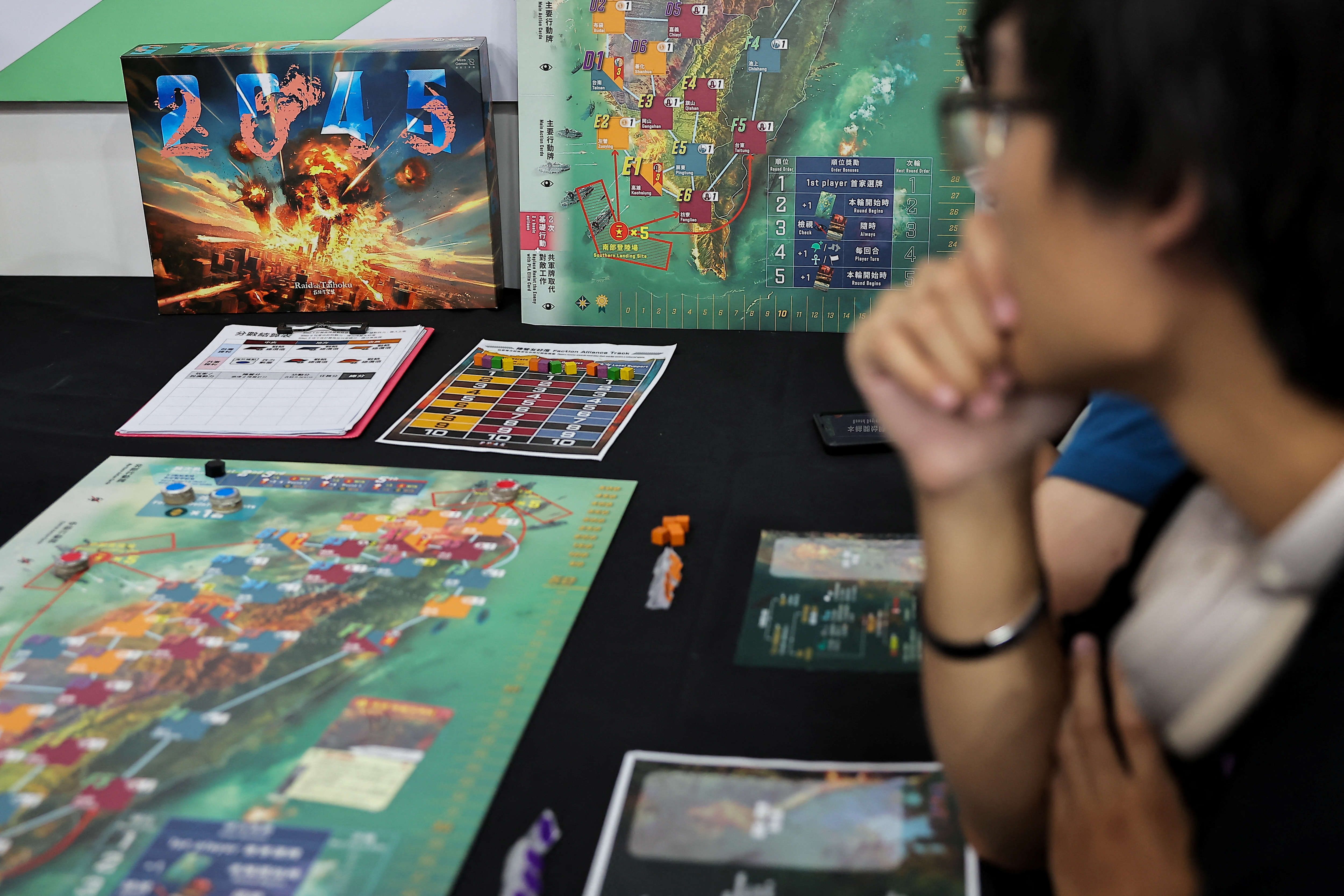 Players test "2045", a new board game by Mizo Games set against the backdrop of armed conflicts around Taiwan, in Taipei
