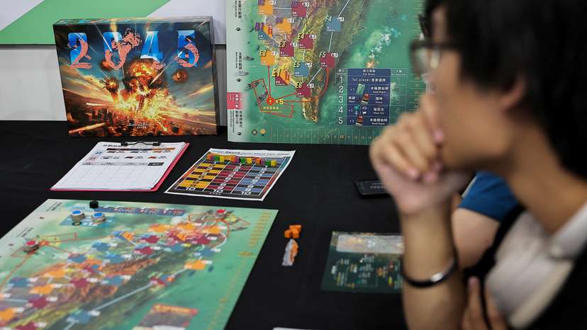 Players test "2045", a new board game by Mizo Games set against the backdrop of armed conflicts around Taiwan, in Taipei