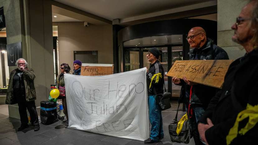 People attend an event celebrating news of the release of WikiLeaks founder Julian Assange at the British Consulate in Melbourne