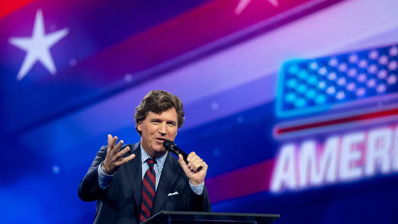 Tucker Carlson speaks as conservative leaders and personalities attend Turning Point USA's AmericaFest 2023 in Phoenix