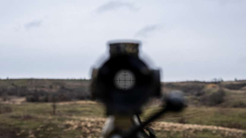 View shows an optical sight on a rifle of a Ukrainian Army sniper at a shooting ground near a front line in Donetsk region