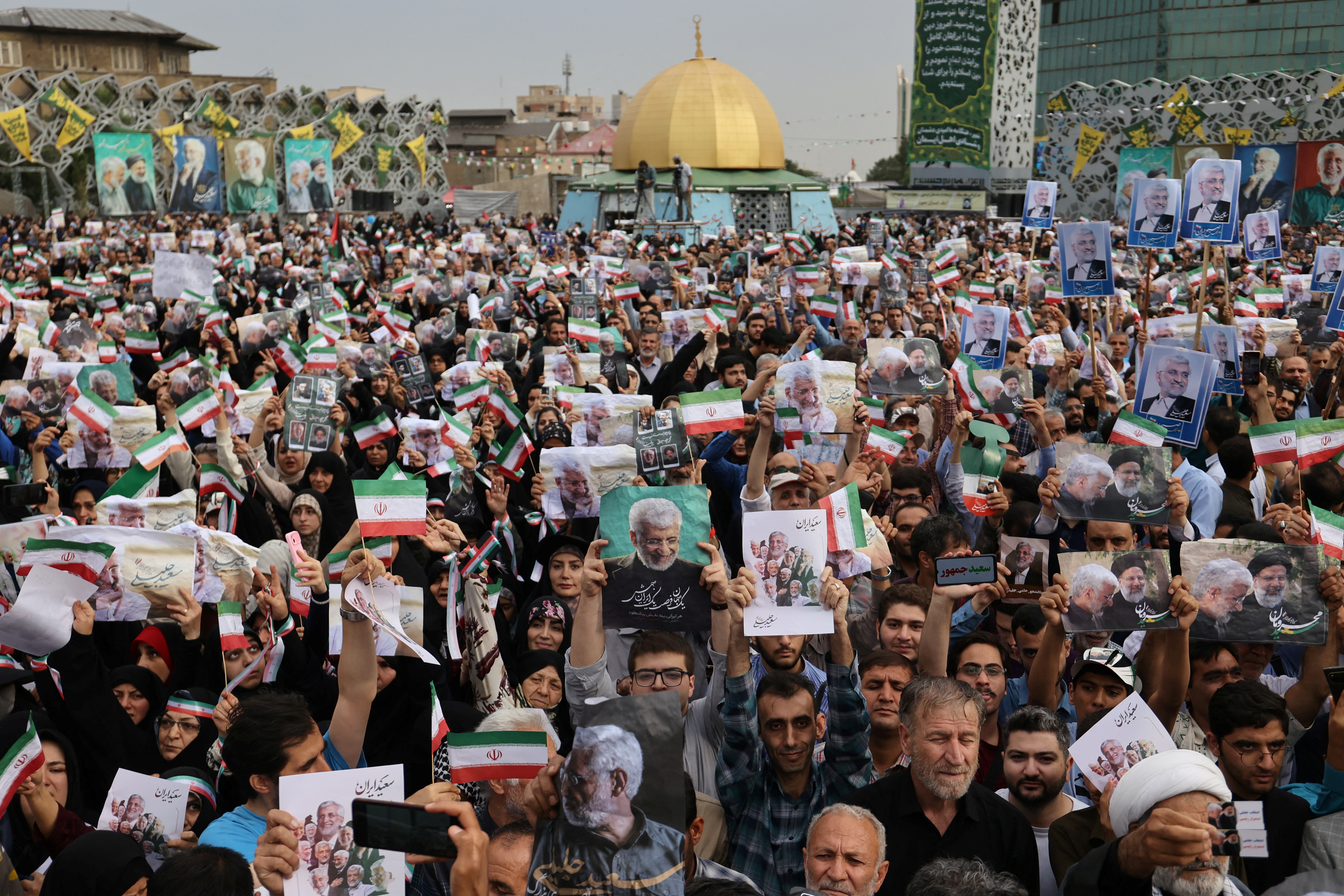 Supporters of Iranian presidential candidate Saeed Jalili attend a campaign event in Tehran