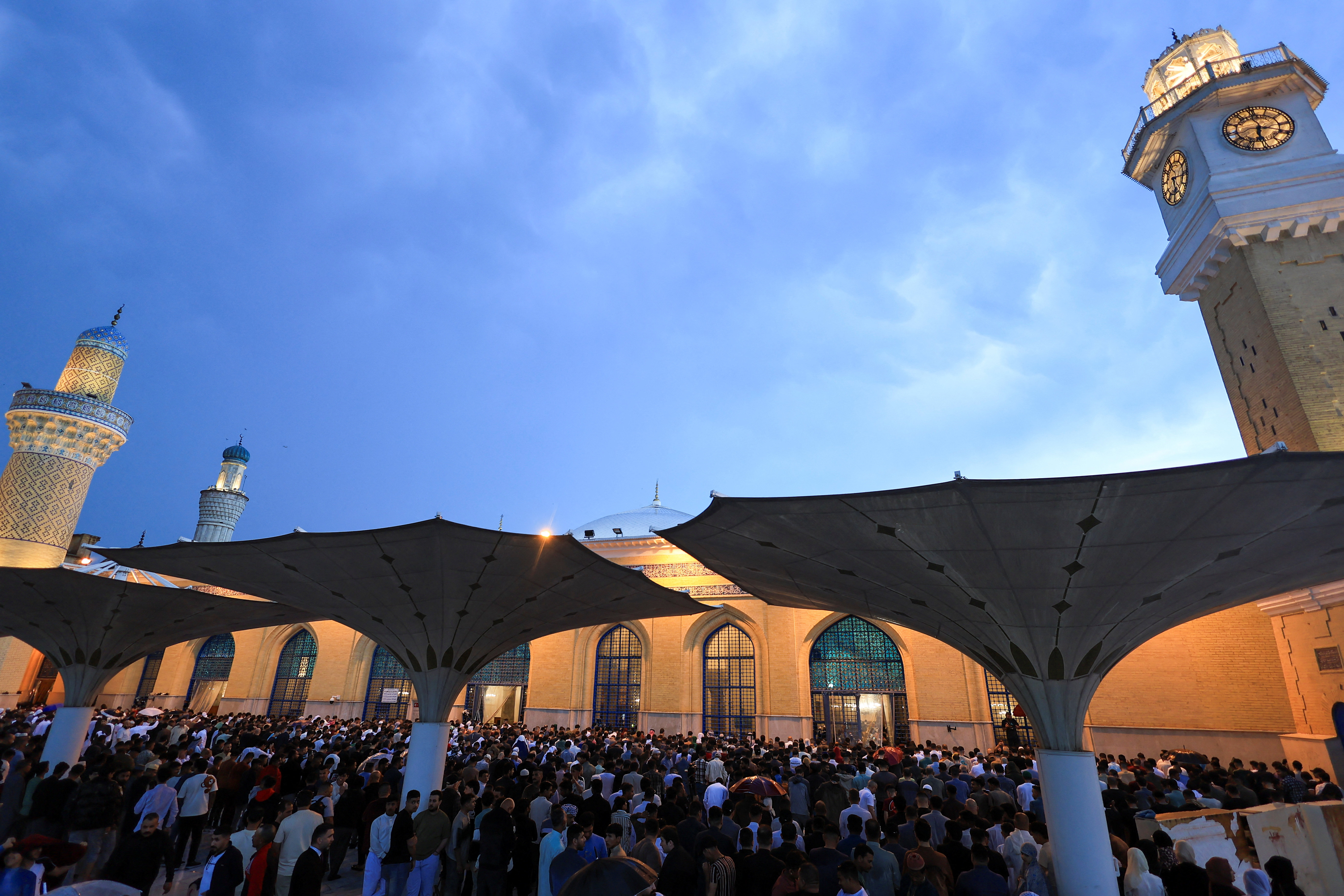 Sunni Muslim worshippers attend Eid al-Fitr prayers in Baghdad