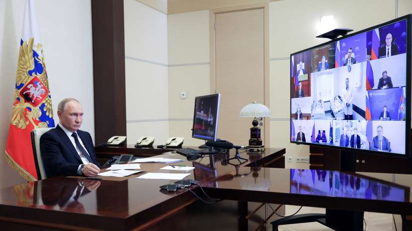 Russian President Putin chairs a meeting with members of the government via video link at a residence outside Moscow