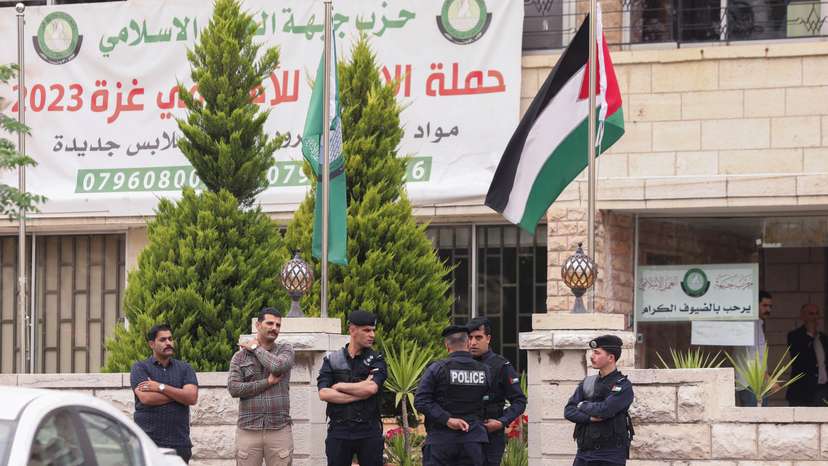 Jordanian police stand outside the Islamic Action Front office in Amman