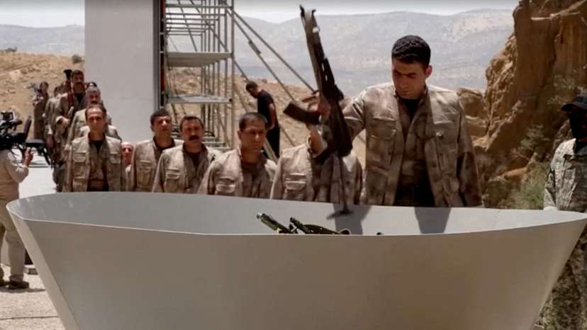 FILE PHOTO: PKK fighters burn weapons during disarming ceremony in Iraqi Kurdistan