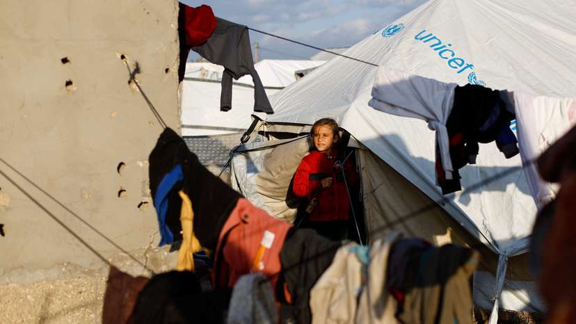 Displaced Palestinians shelter in a tent camp in Deir al-Balah