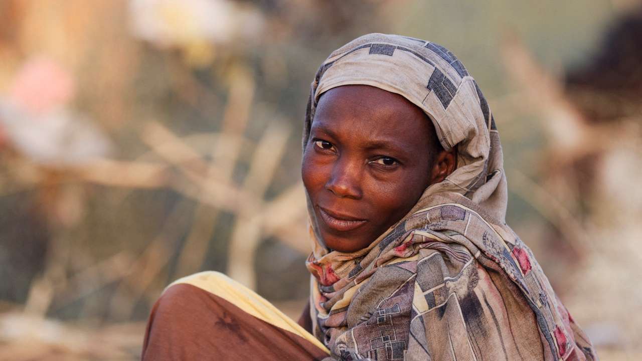 Najlaa Ahmed, a displaced Sudanese mother looks on after following by RSF attacks on Zamzam camp shelter in Tawila