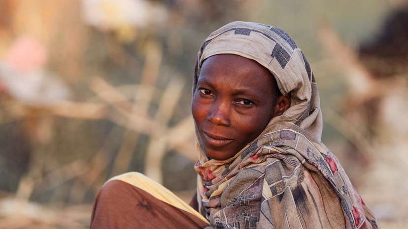 Najlaa Ahmed, a displaced Sudanese mother looks on after following by RSF attacks on Zamzam camp shelter in Tawila