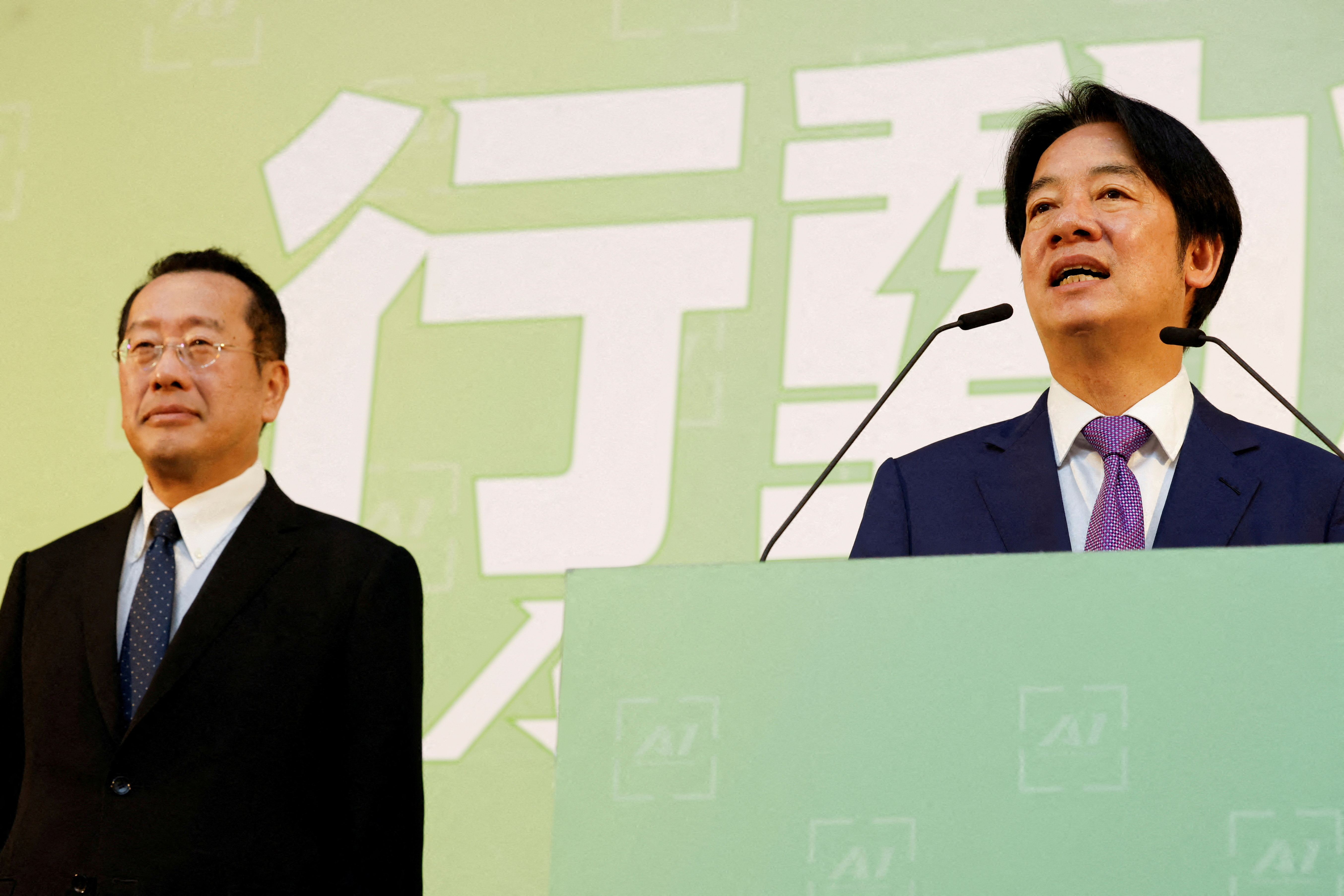 FILE PHOTO: Taiwan President-elect Lai Ching-te speaks as incoming Defence Minister Wellington Koo stands next to him during a press conference, in Taipei