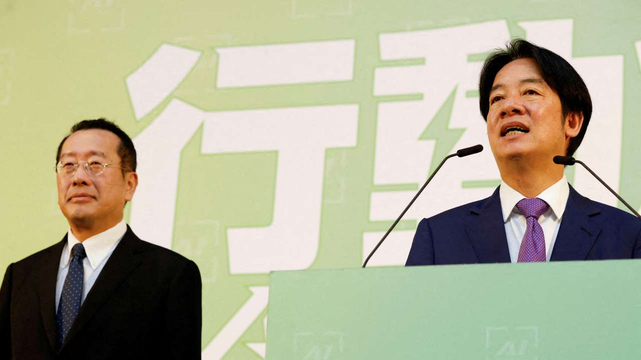FILE PHOTO: Taiwan President-elect Lai Ching-te speaks as incoming Defence Minister Wellington Koo stands next to him during a press conference, in Taipei