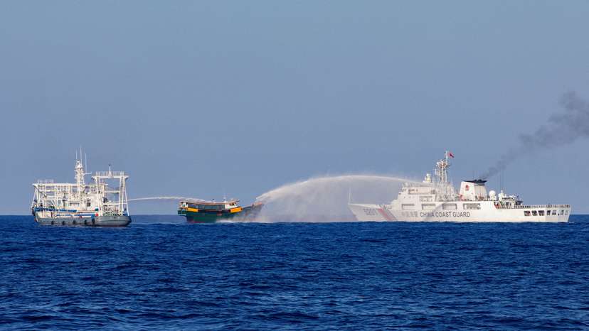 FILE PHOTO: Chinese Coast Guard vessels fire water cannons towards a Philippine resupply vessel Unaizah May 4 on its way to a resupply mission at Second Thomas Shoal in the South China Sea