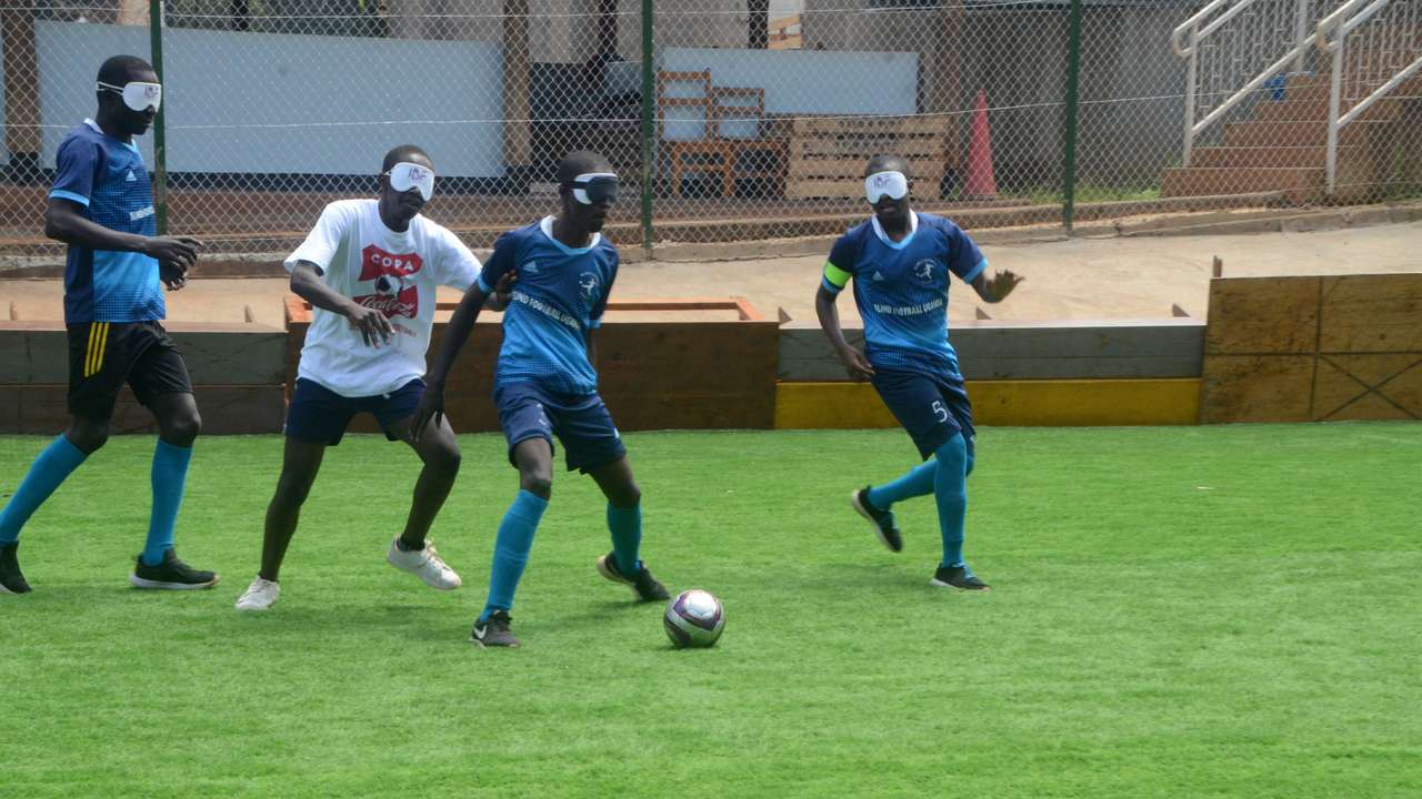 blind football players compete during amatch