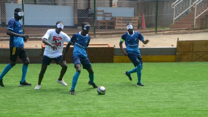 blind football players compete during amatch