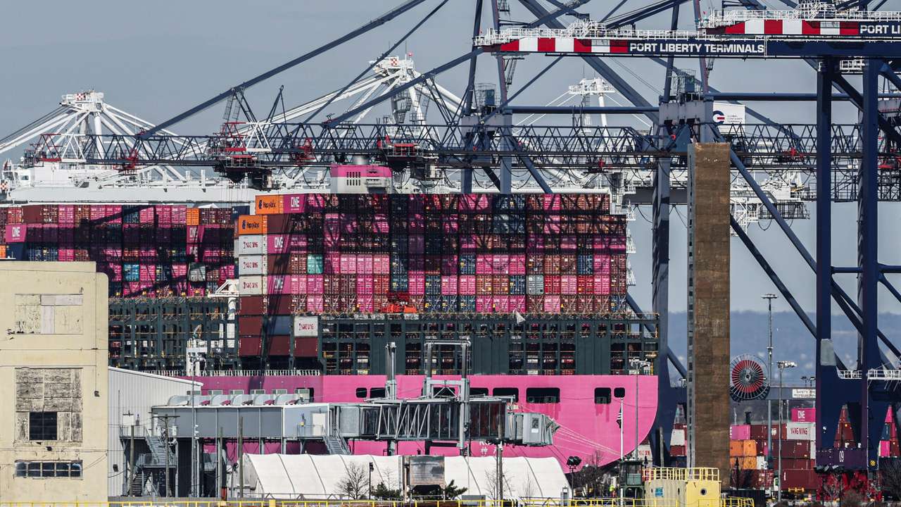 Containers are stacked on the deck of cargo ship One Minato at Port Liberty New York in Staten Island, New York