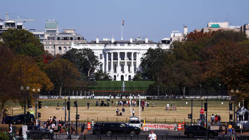 People gather outside the White House, in Washington