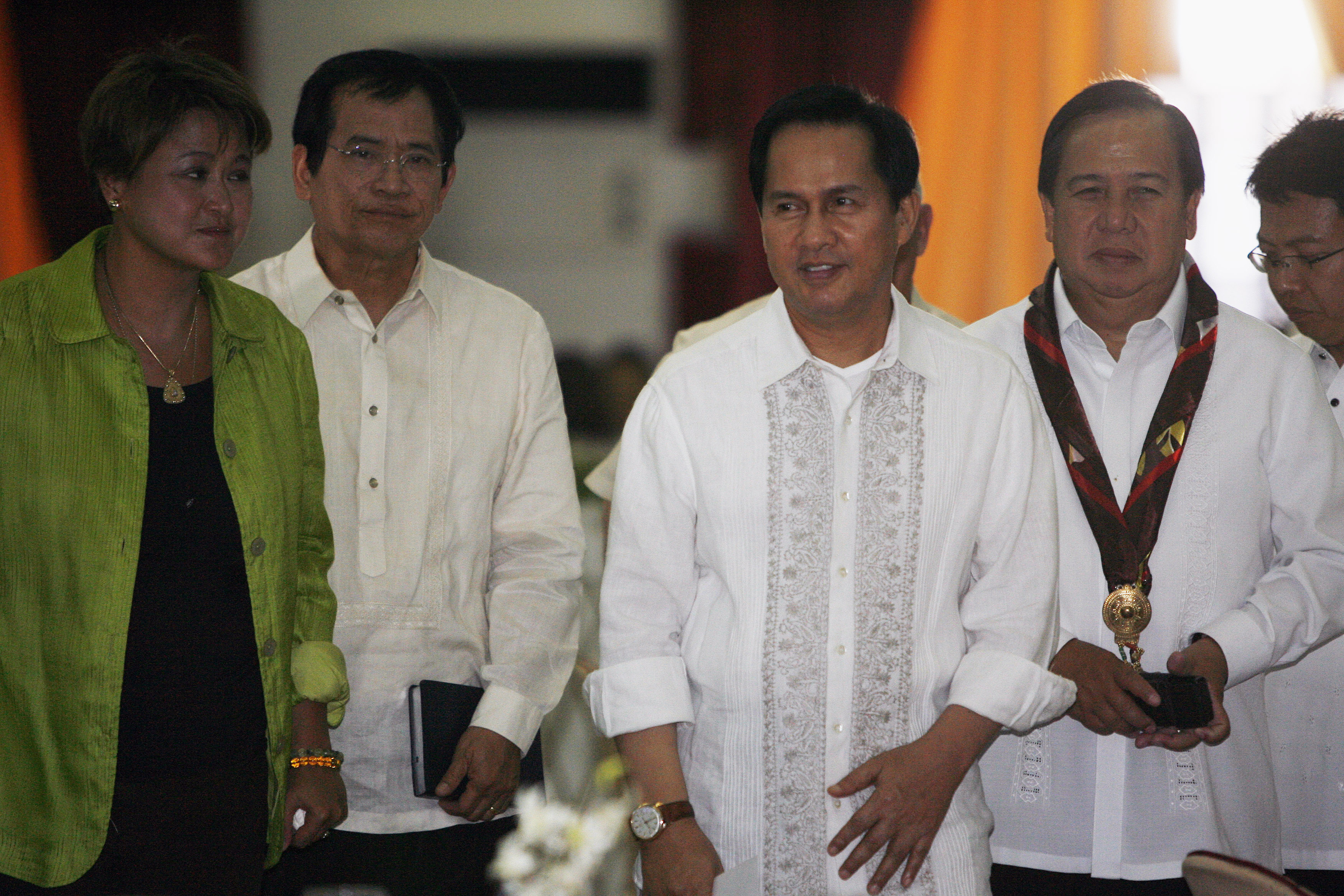 International evangelist Pastor Apollo Quiboloy (2nd R) walks with presidential candidates attending his 60th birthday celebration in Davao City