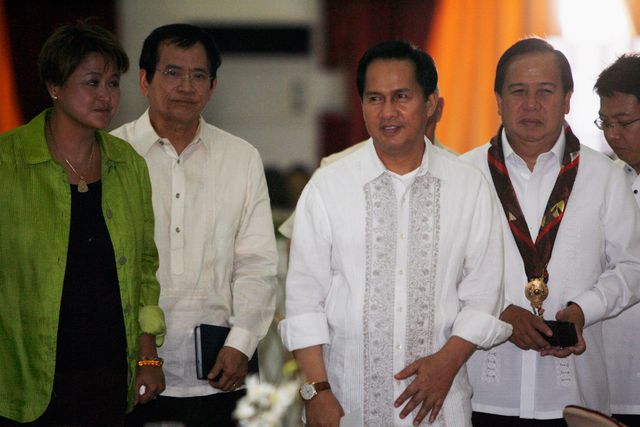 International evangelist Pastor Apollo Quiboloy (2nd R) walks with presidential candidates attending his 60th birthday celebration in Davao City