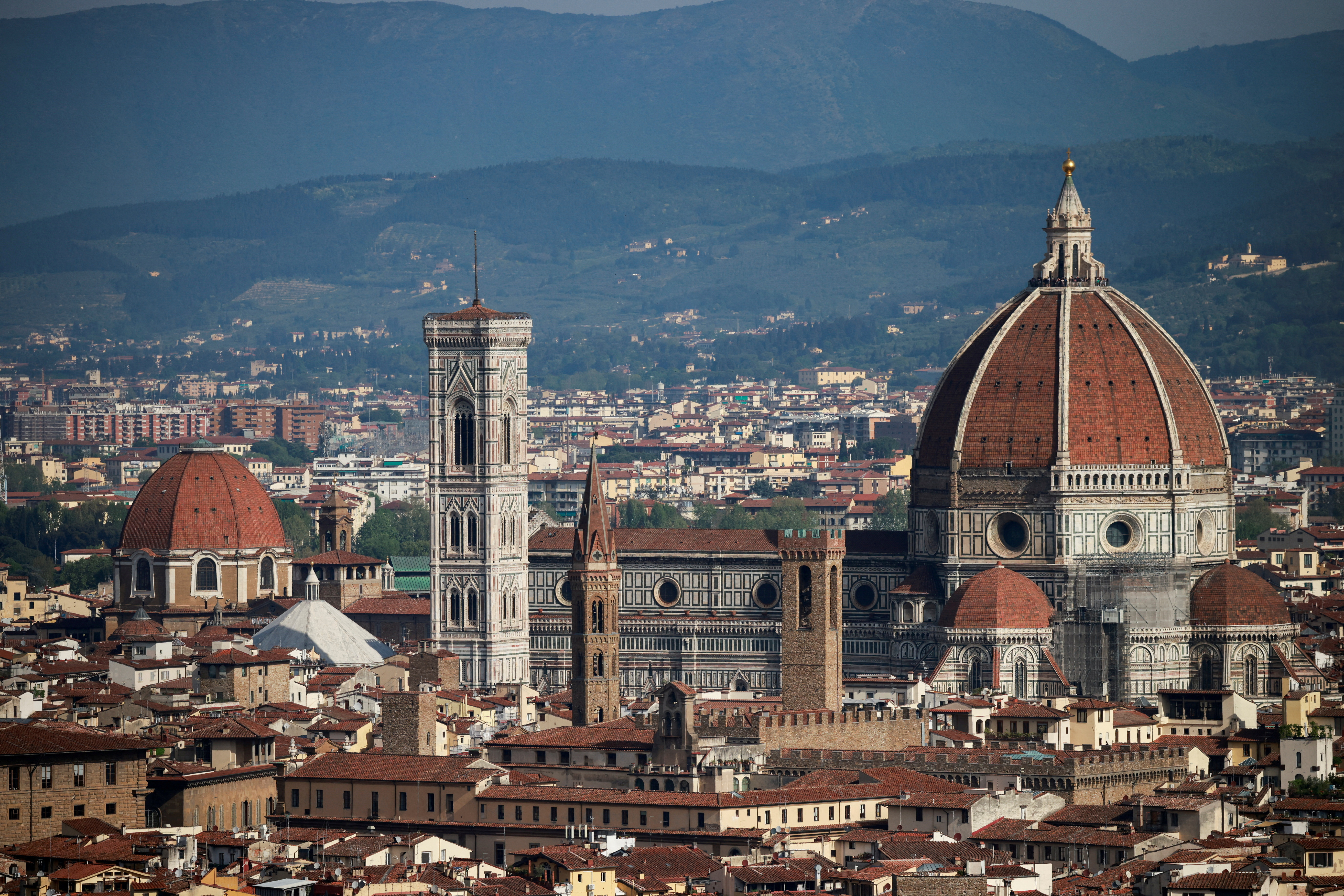 FILE PHOTO: Brunelleschi's Dome and Giotto's Campanile of the Cathedral of Saint Mary of the Flower (Cattedrale di Santa Maria del Fiore) are pictured from a panoramic point of Florence