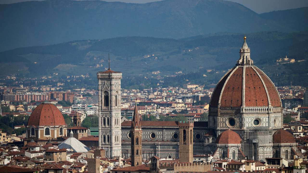 FILE PHOTO: Brunelleschi's Dome and Giotto's Campanile of the Cathedral of Saint Mary of the Flower (Cattedrale di Santa Maria del Fiore) are pictured from a panoramic point of Florence
