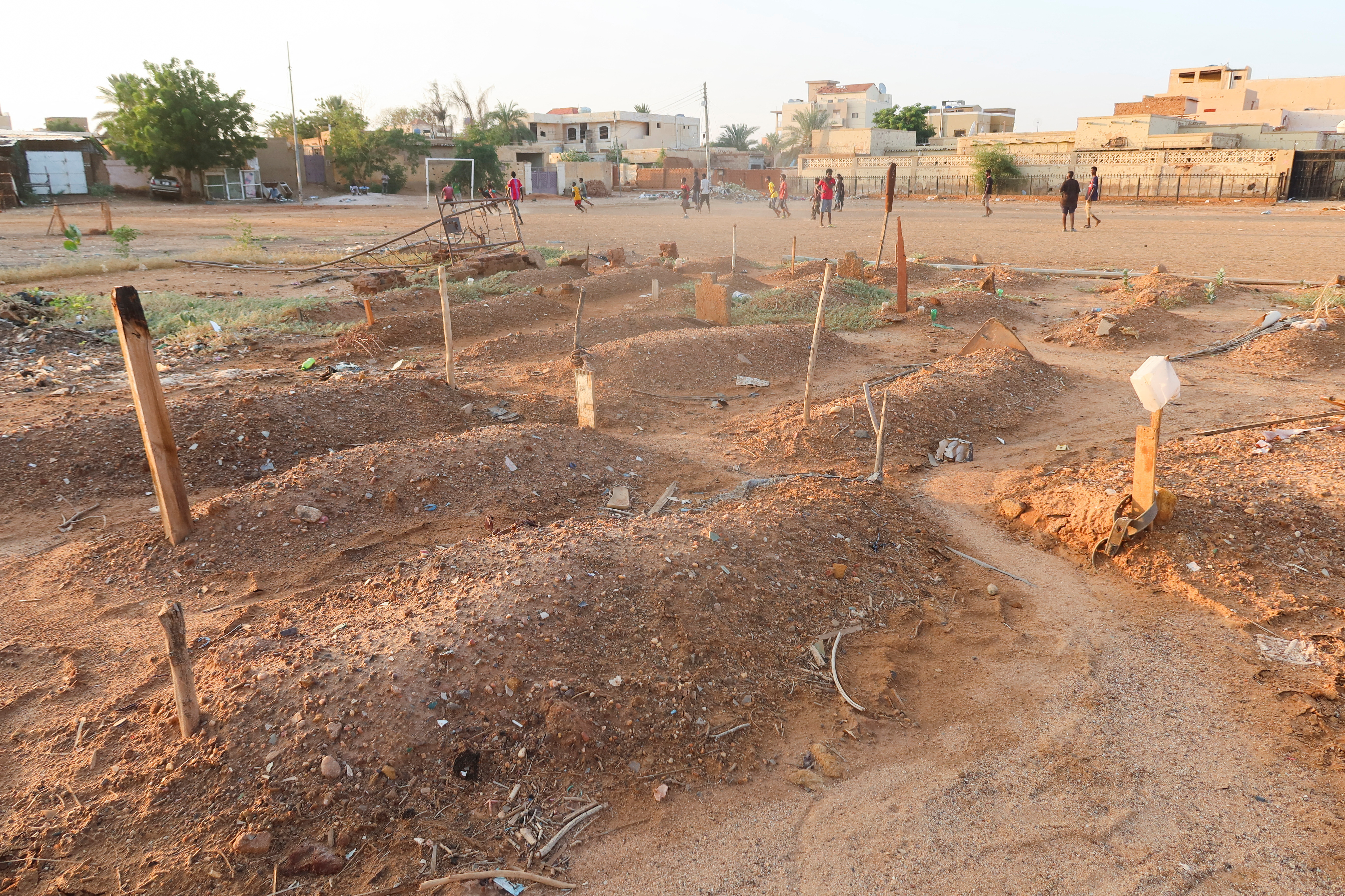 Graves are seen in residential area in Omdurman, Sudan