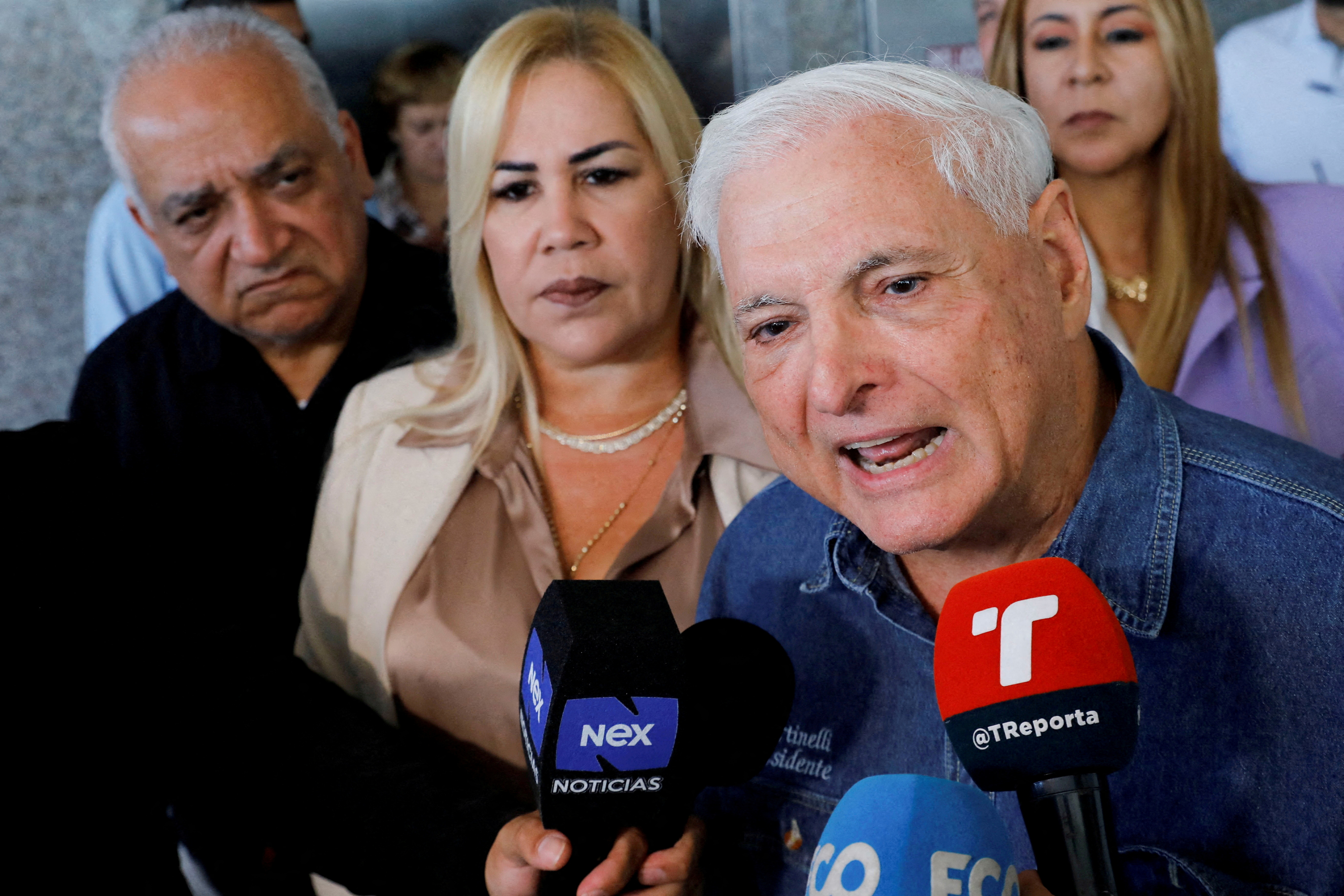 FILE PHOTO: Panama's former President Ricardo Martinelli addresses the media while leaving the National Assembly, in Panama City