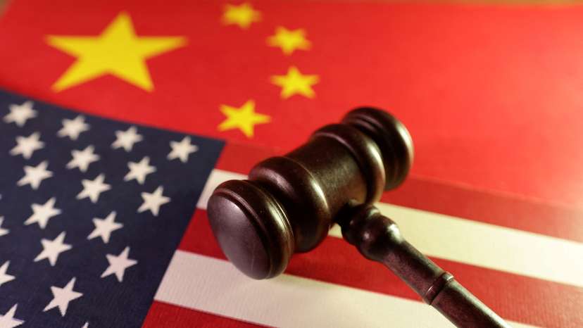 Illustration shows U.S. and Chinese flags and gavel