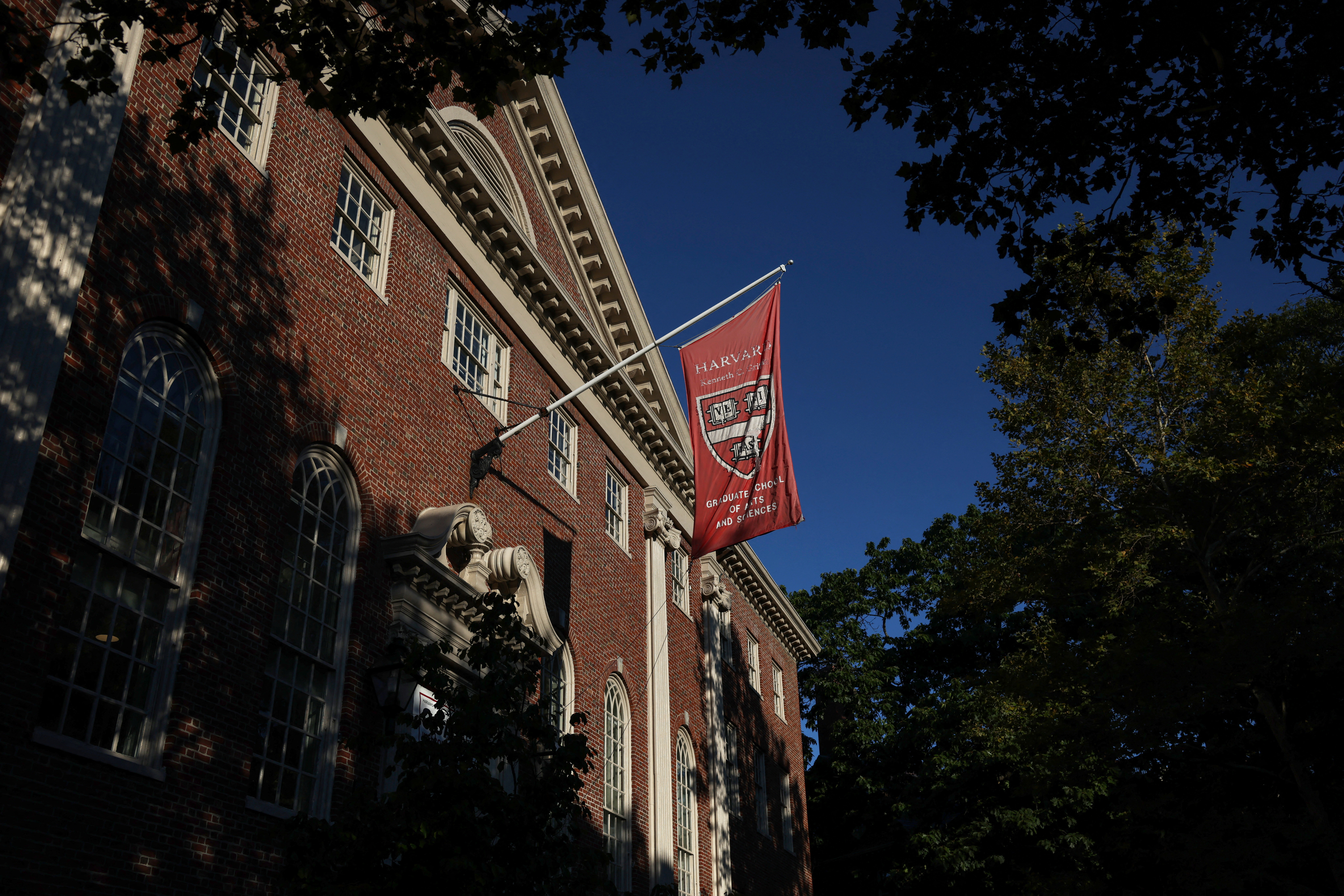 A flag hangs on campus at Harvard University in Cambridge, Massachusetts