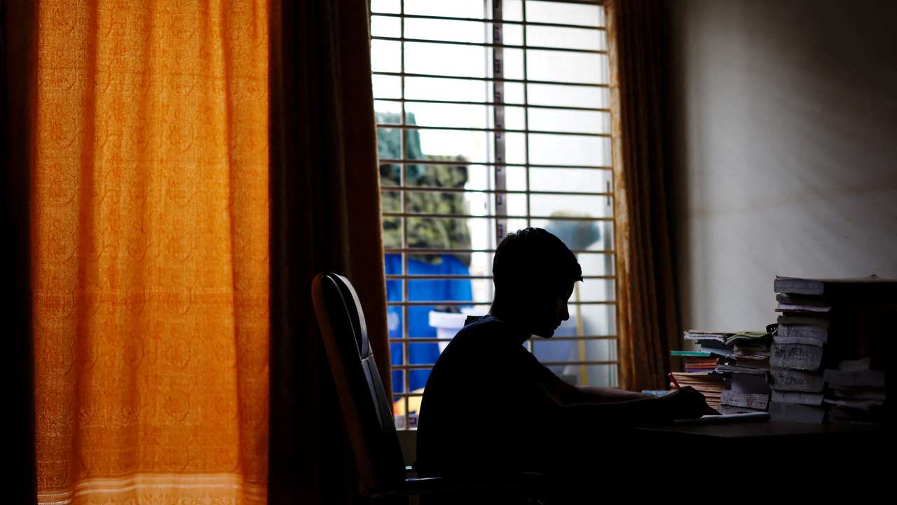 Sheikh Tamim Hasan, 13, a student of class seven, studies in his room as authorities decided to close schools during countrywide heatwave in Dhaka