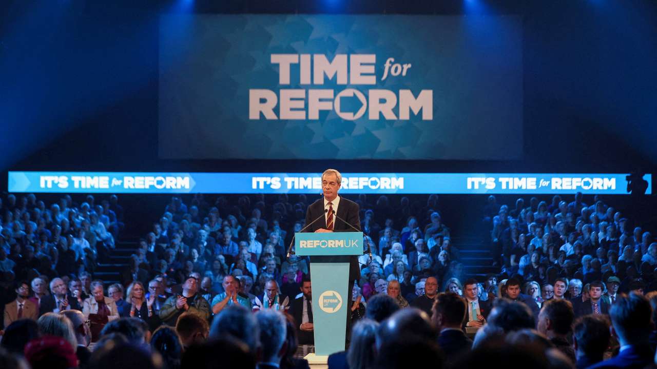 FILE PHOTO: Britain's Reform UK party leader Nigel Farage delivers a speech at a party rally in Birmingham