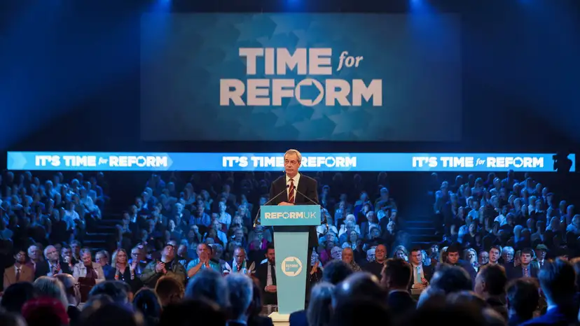 FILE PHOTO: Britain's Reform UK party leader Nigel Farage delivers a speech at a party rally in Birmingham