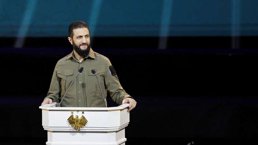 FILE PHOTO: Syria's President Ahmed al-Sharaa delivers a speech on the first anniversary of Bashar al-Assad's fall