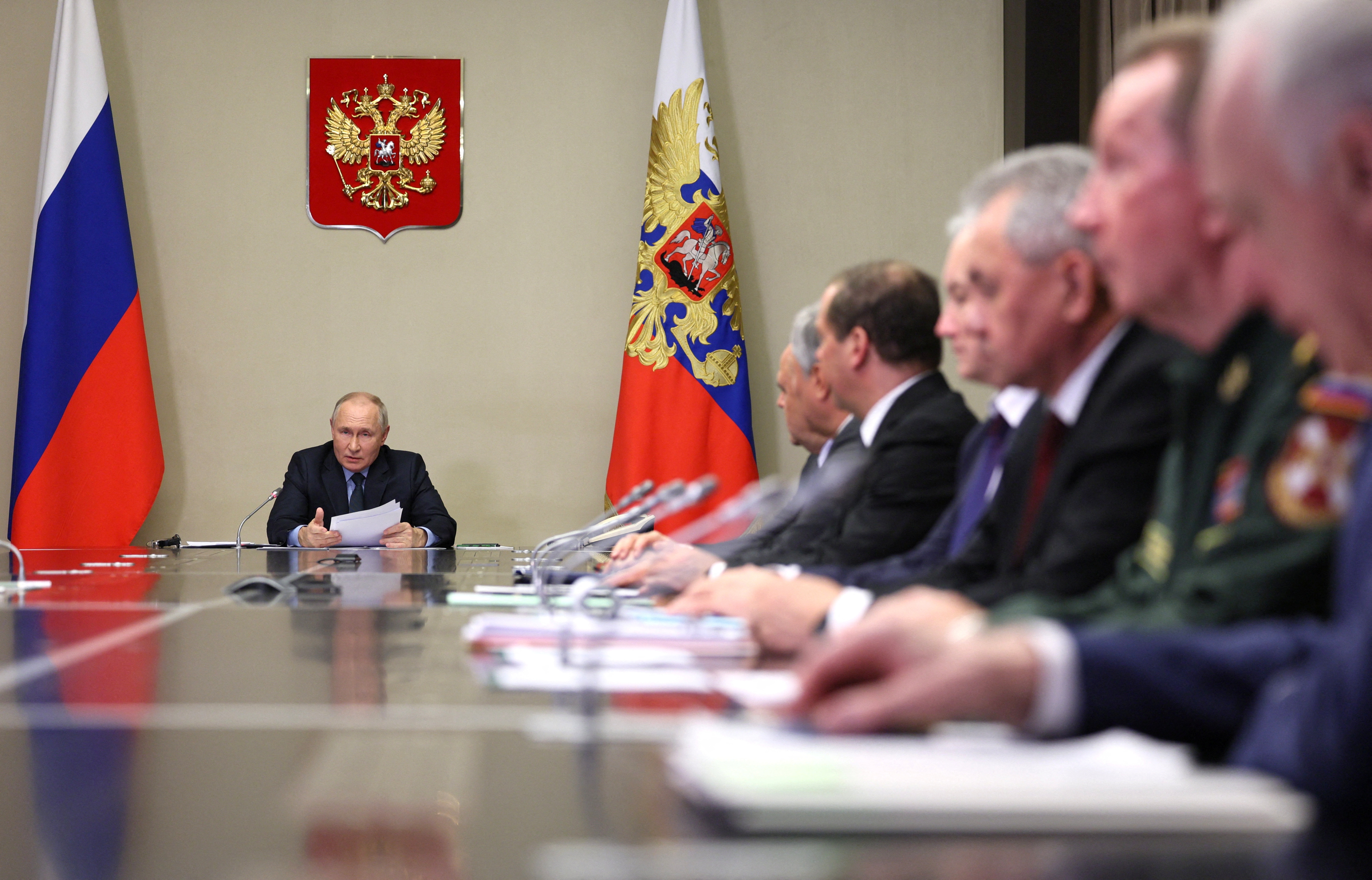 Russian President Vladimir Putin chairs a meeting of members of his Security Council and the government and the heads of law enforcement agencies, outside Moscow
