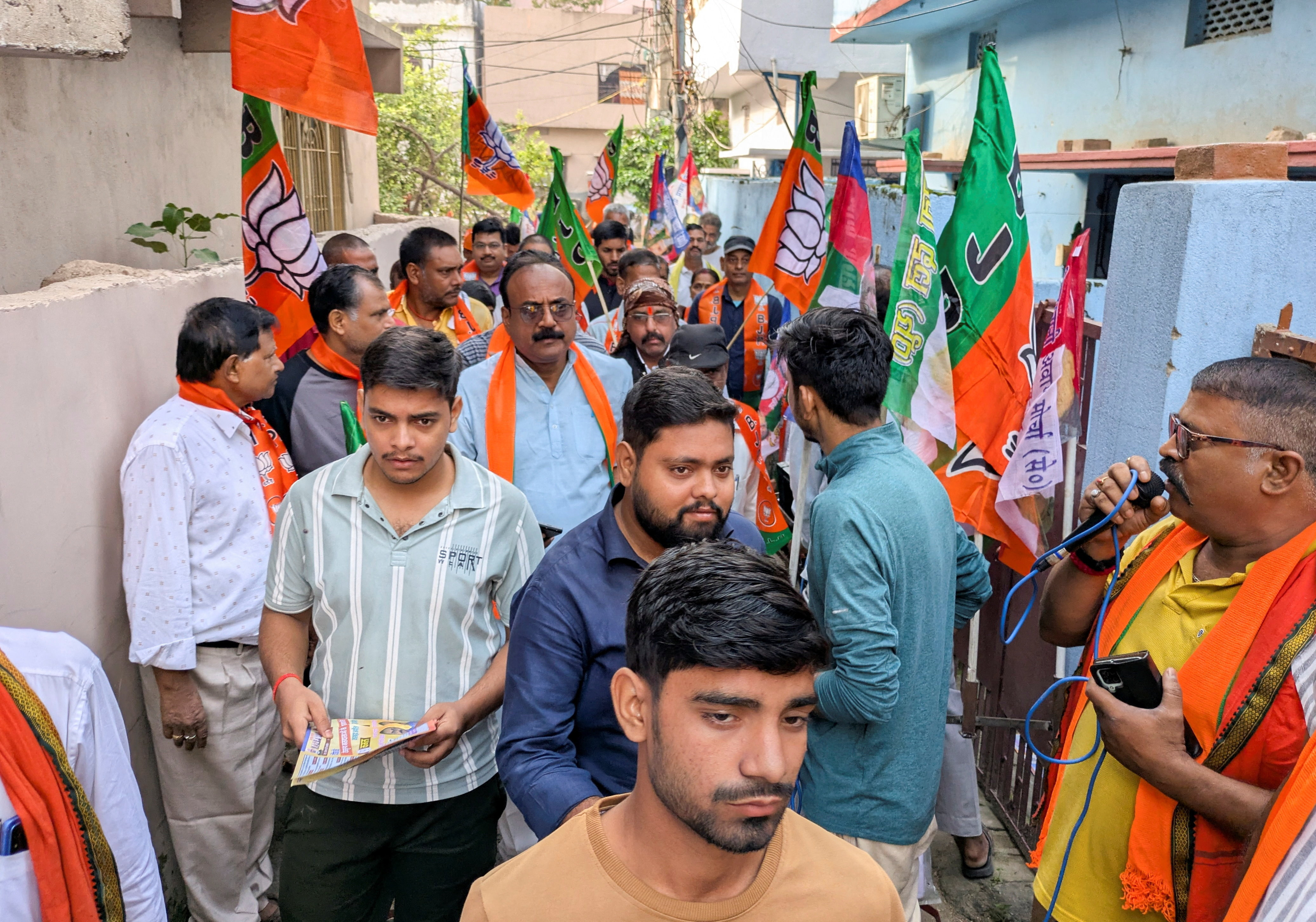 People take part in a voting campaign for a local BJP candidate, held in the Deegha area of Patna