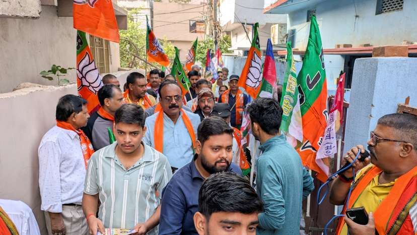 People take part in a voting campaign for a local BJP candidate, held in the Deegha area of Patna