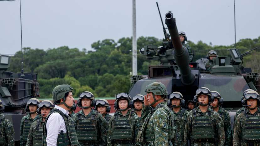 A soldier salutes Taiwan president Lai Ching-te in front of U.S.-made M1A2T Abrams tanks in Hsinchu