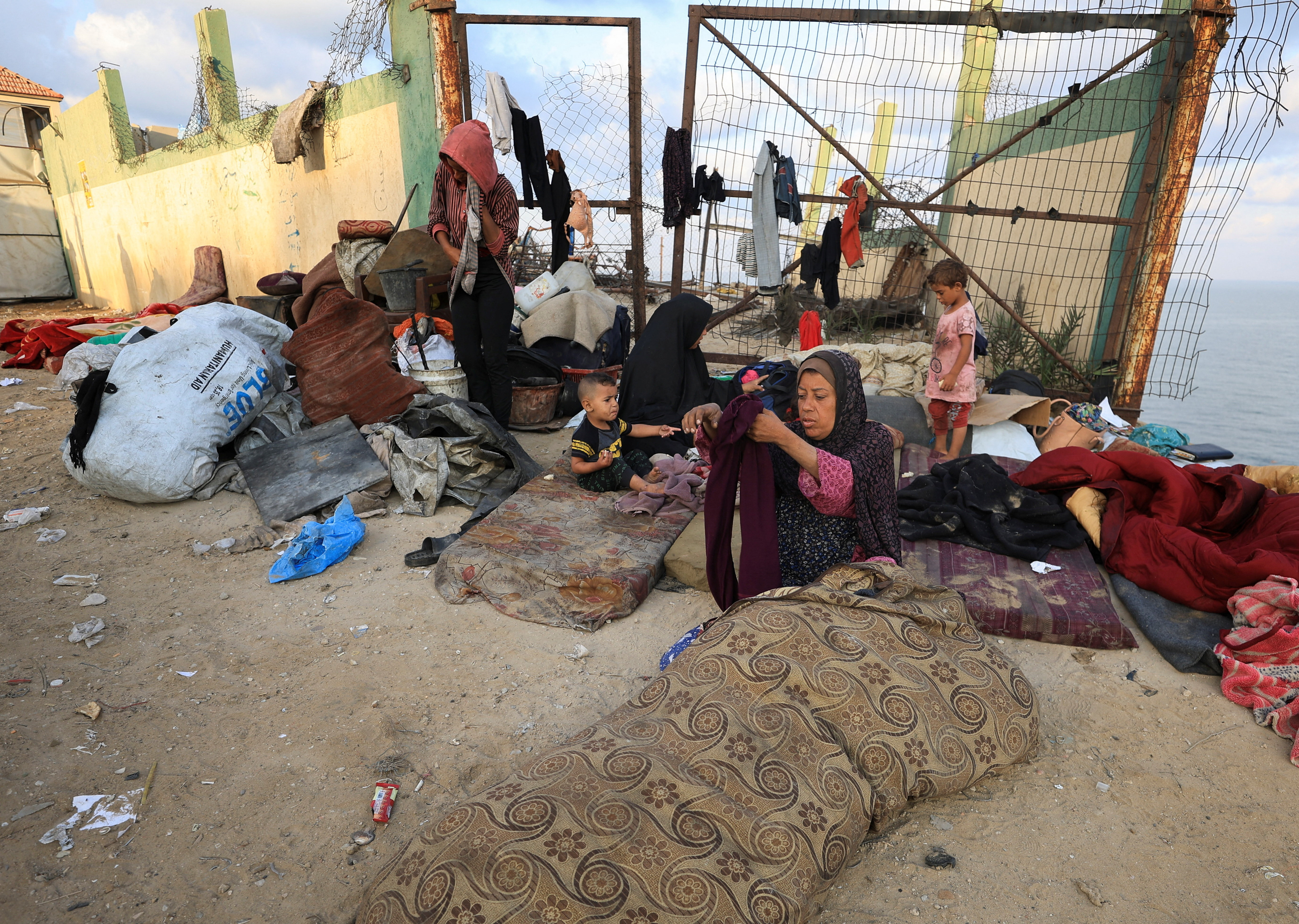 Displaced Palestinians, fleeing northern Gaza due to an Israeli military operation, move southward, in the central Gaza Strip