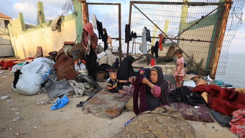 Displaced Palestinians, fleeing northern Gaza due to an Israeli military operation, move southward, in the central Gaza Strip