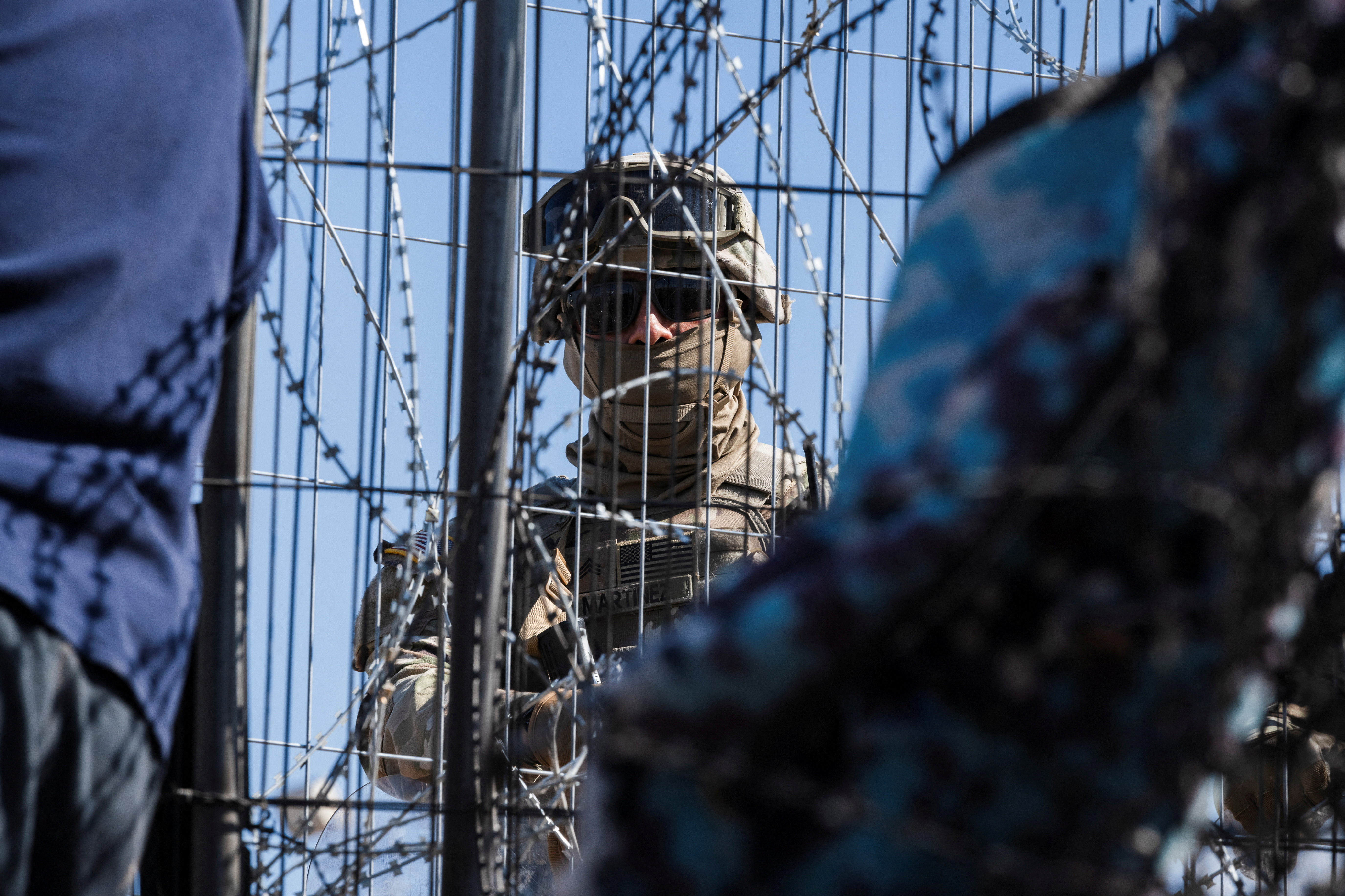 FILE PHOTO: Texas law enforcement officers work at the border as migrants cross