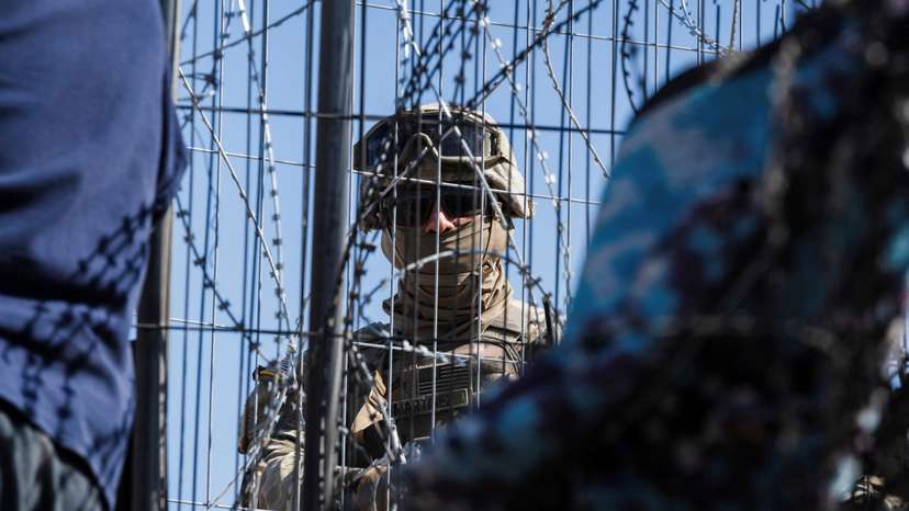 FILE PHOTO: Texas law enforcement officers work at the border as migrants cross