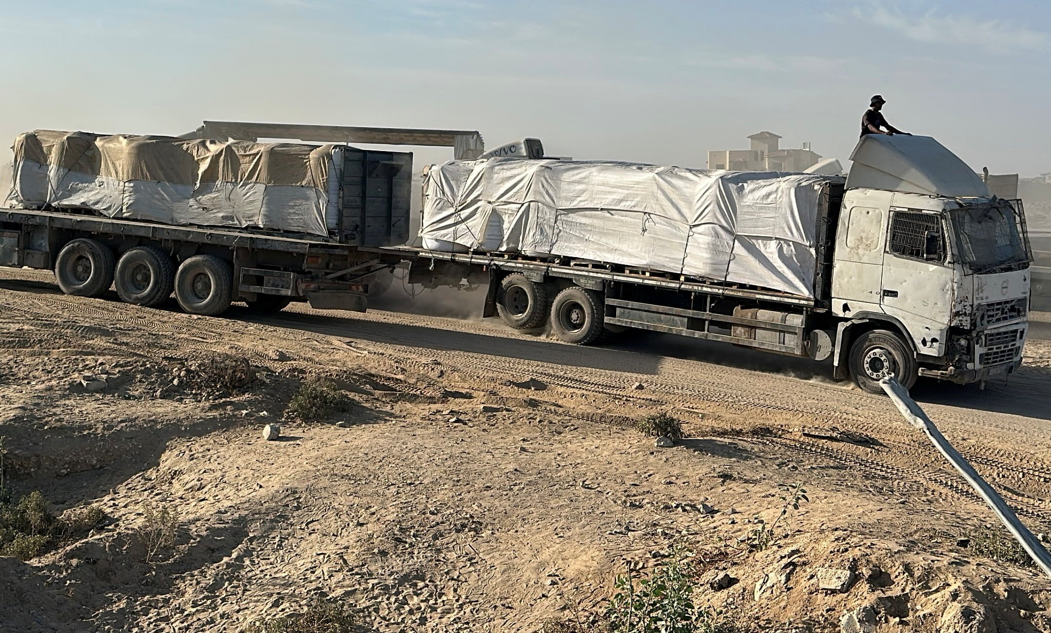 Trucks carry aid for Palestinians in Khan Younis
