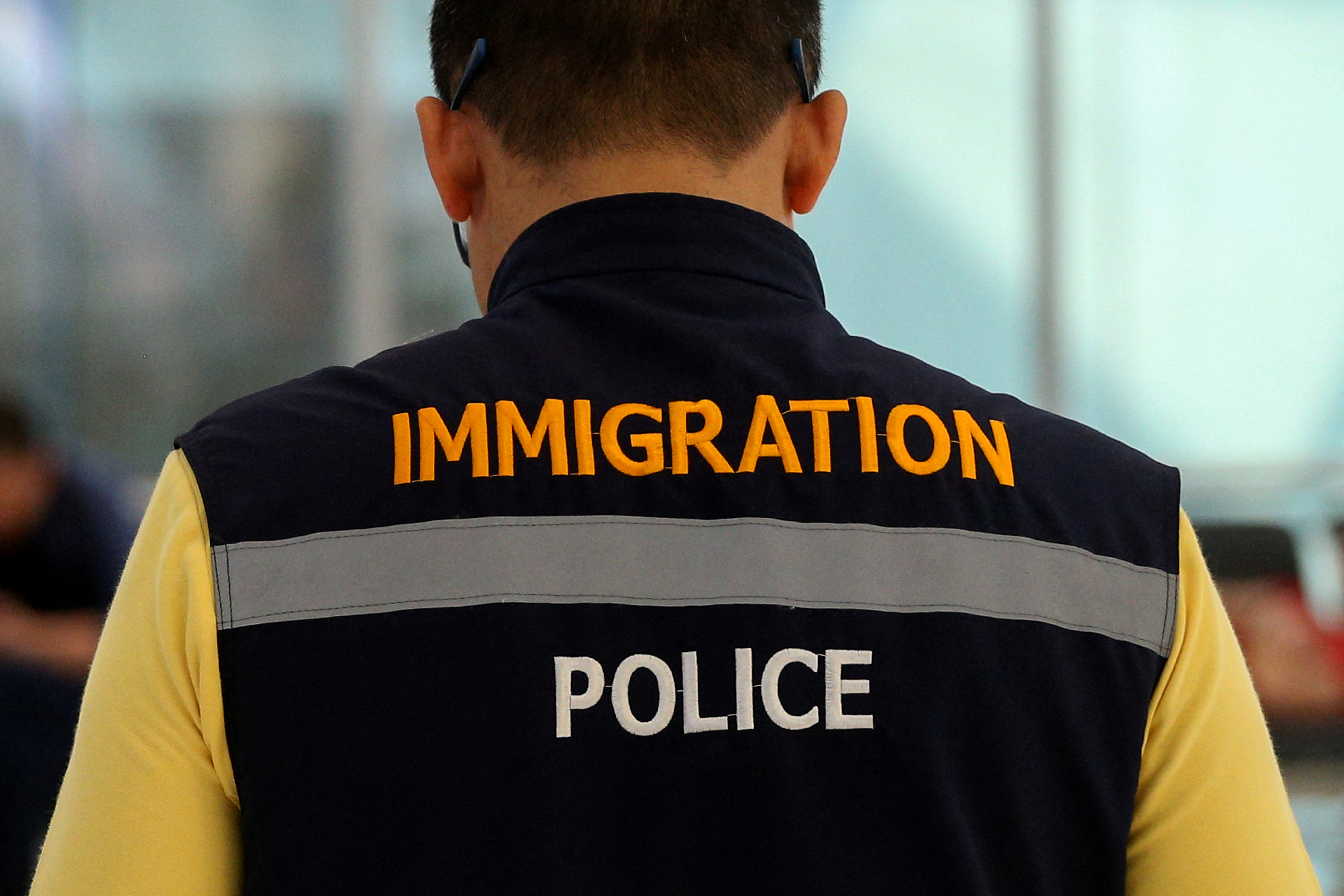 FILE PHOTO: A Thai immigartion police is seen in front of a hotel inside transit area at Suvarnabhumi Airport where Rahaf Mohammed al-Qunun, an 18-year-old Saudi woman who claims to be fleeing her family has barricaded herself inside a room in Bangkok