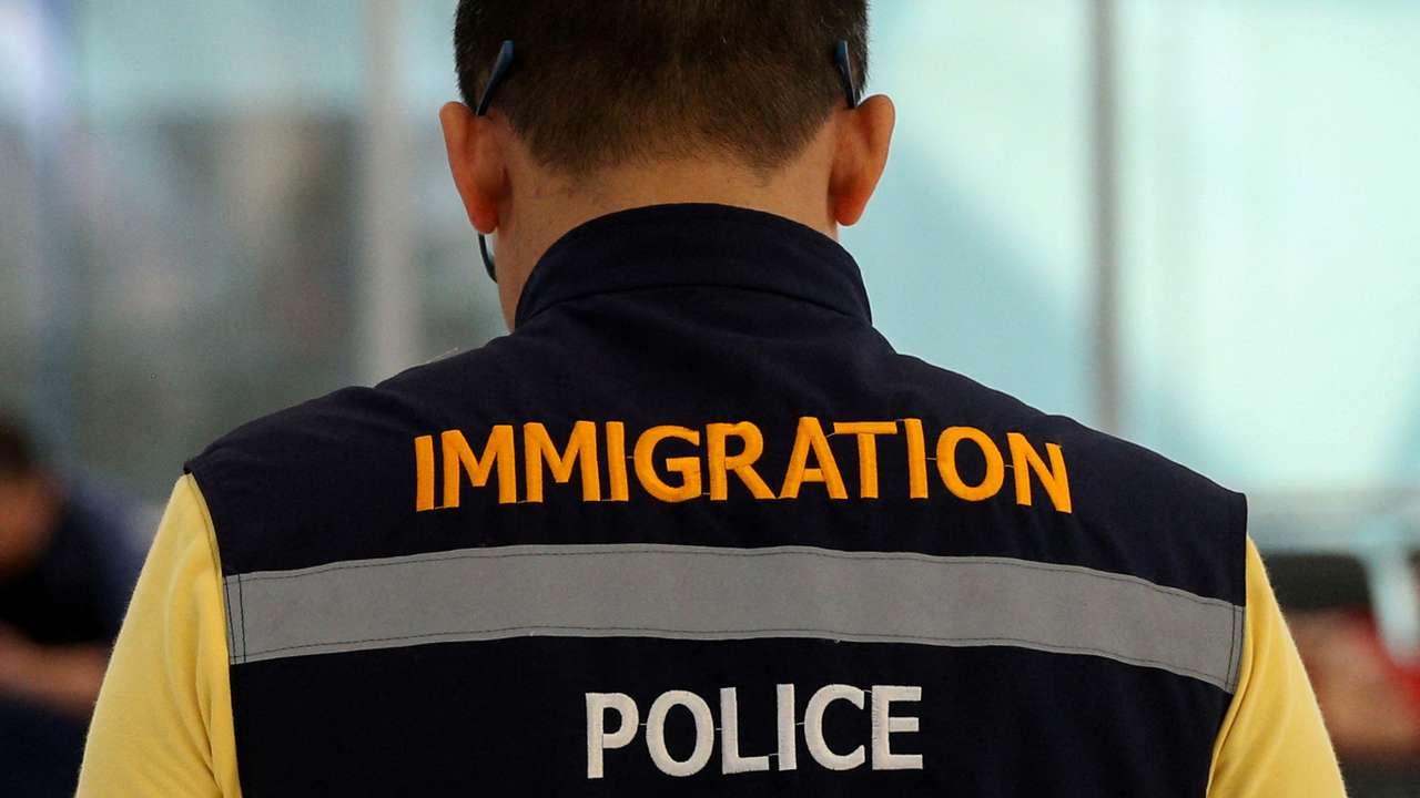 FILE PHOTO: A Thai immigartion police is seen in front of a hotel inside transit area at Suvarnabhumi Airport where Rahaf Mohammed al-Qunun, an 18-year-old Saudi woman who claims to be fleeing her family has barricaded herself inside a room in Bangkok