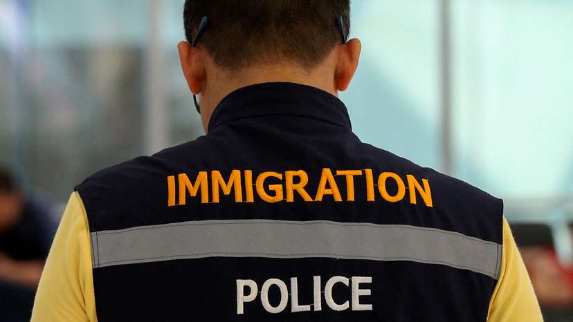 FILE PHOTO: A Thai immigartion police is seen in front of a hotel inside transit area at Suvarnabhumi Airport where Rahaf Mohammed al-Qunun, an 18-year-old Saudi woman who claims to be fleeing her family has barricaded herself inside a room in Bangkok