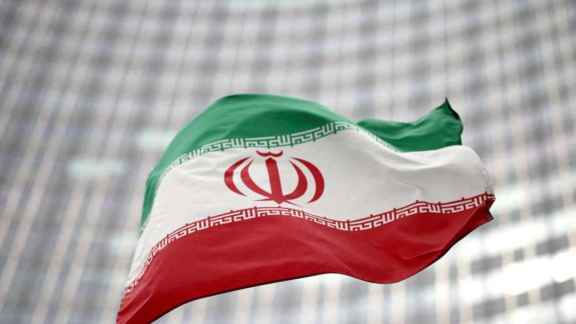 FILE PHOTO: Iranian flag flies in front of the UN office building in Vienna