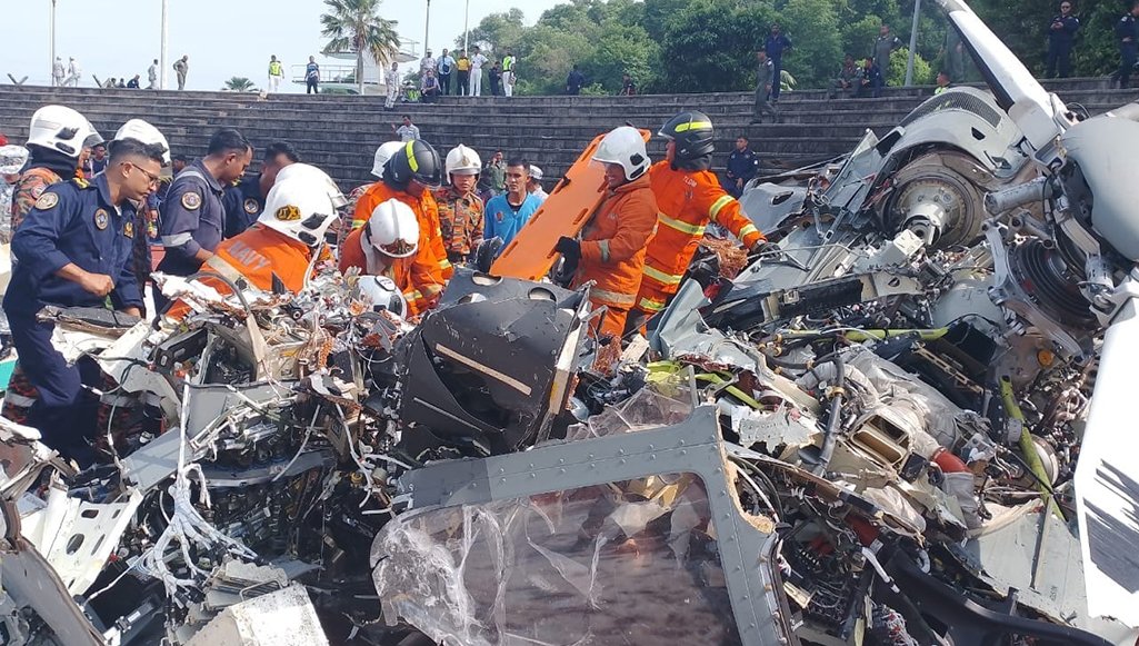 Wreckage of a Royal Malaysian Navy helicopters after it collided with another rotors in mid-air in Lumut, Malaysia. 10 killed