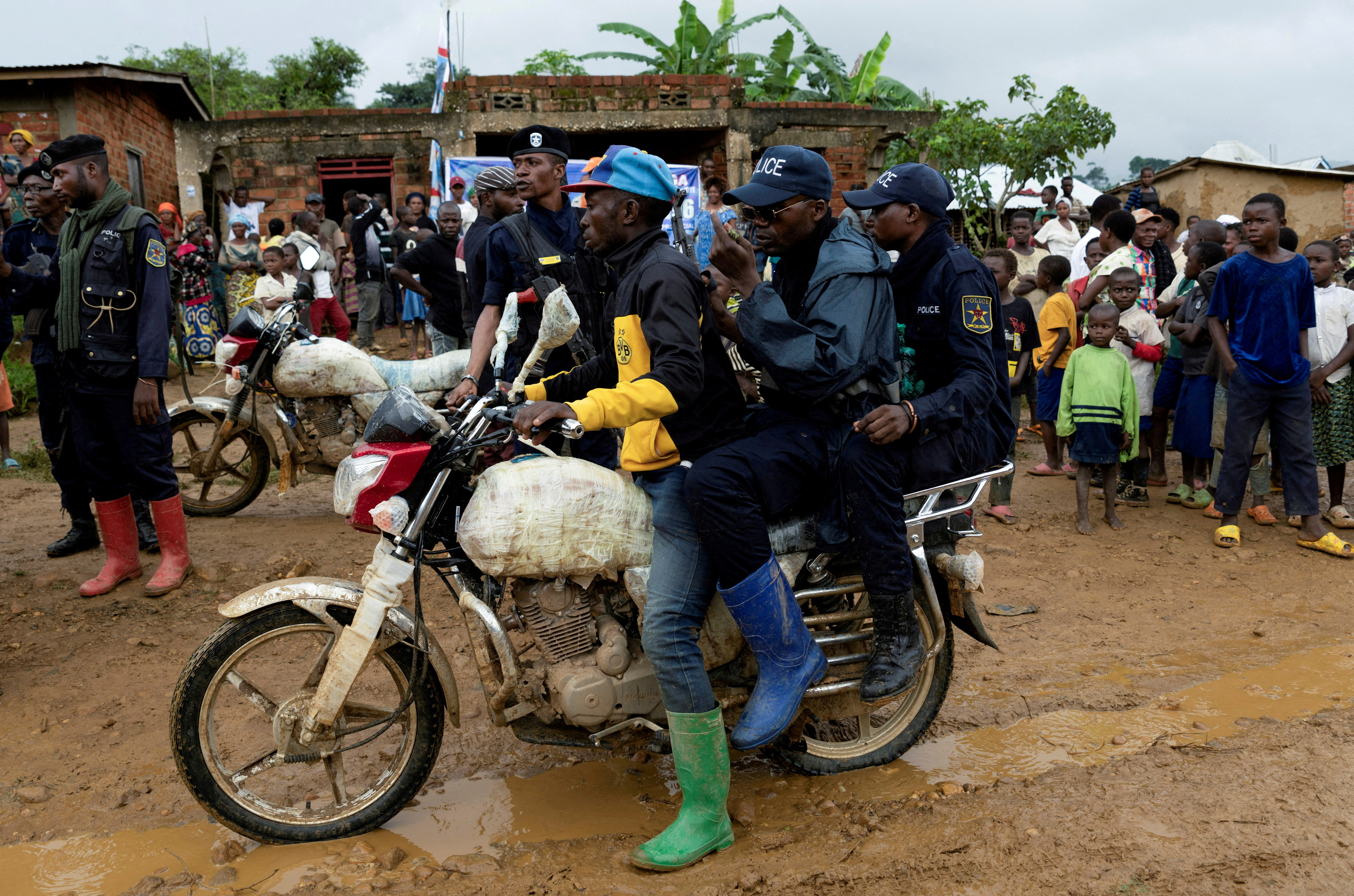 FILE PHOTO: Congolese police officers secure the streets during a campaign rally of presidential candidate Moise Katumbi in Kitutu village, South Kivu province, Democratic Republic of the Congo