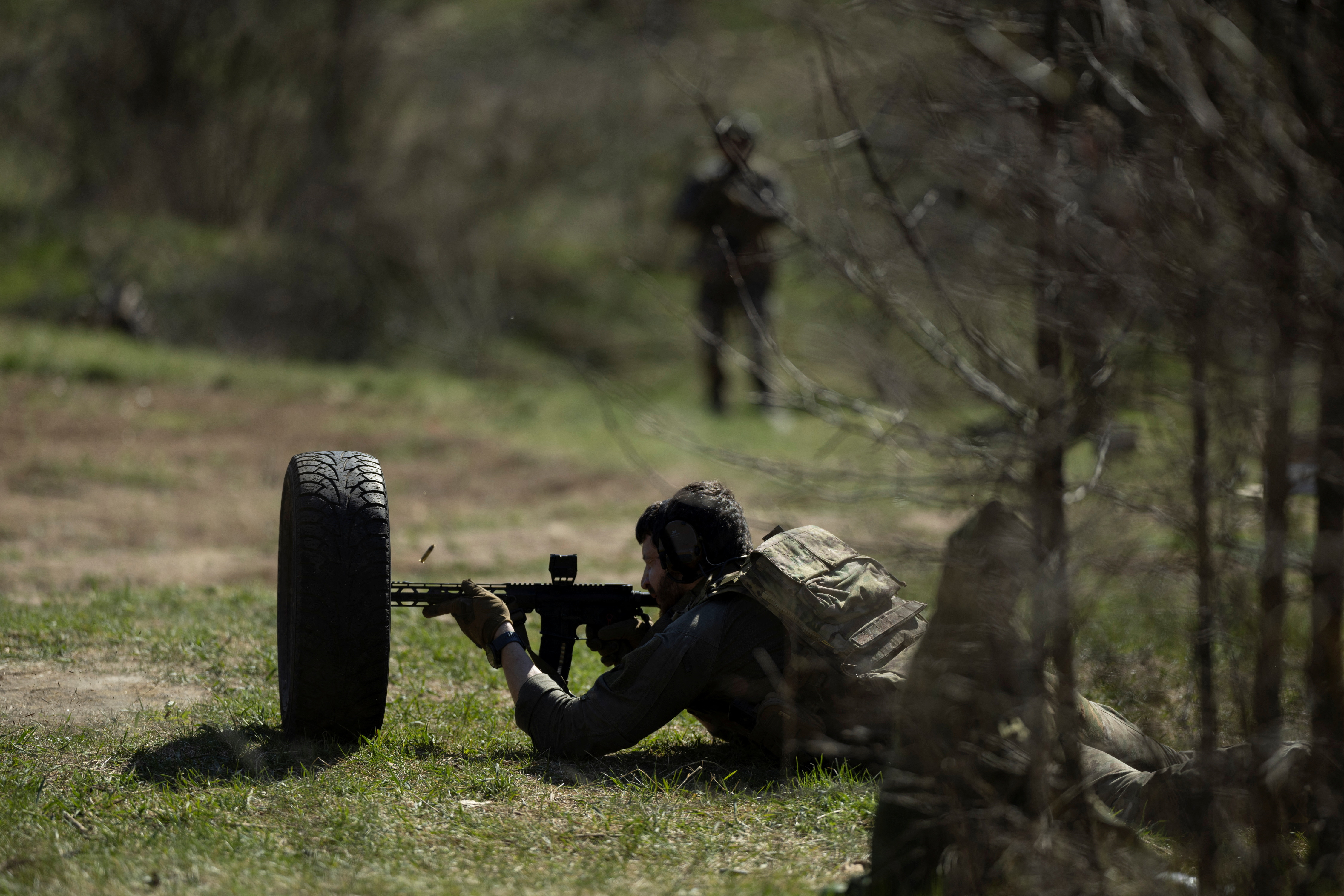 A Ukrainian serviceman of the 58th brigade practices at a shooting range in the Donetsk region