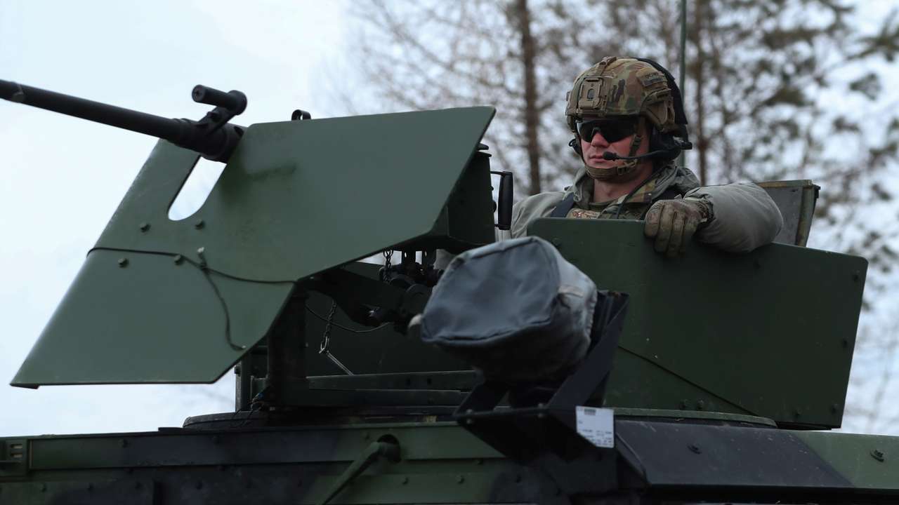 U.S. Army soldiers from the 82nd Airborne Division drive HMMWV (Humvee) vehicle towards an airbase, near Arlamow