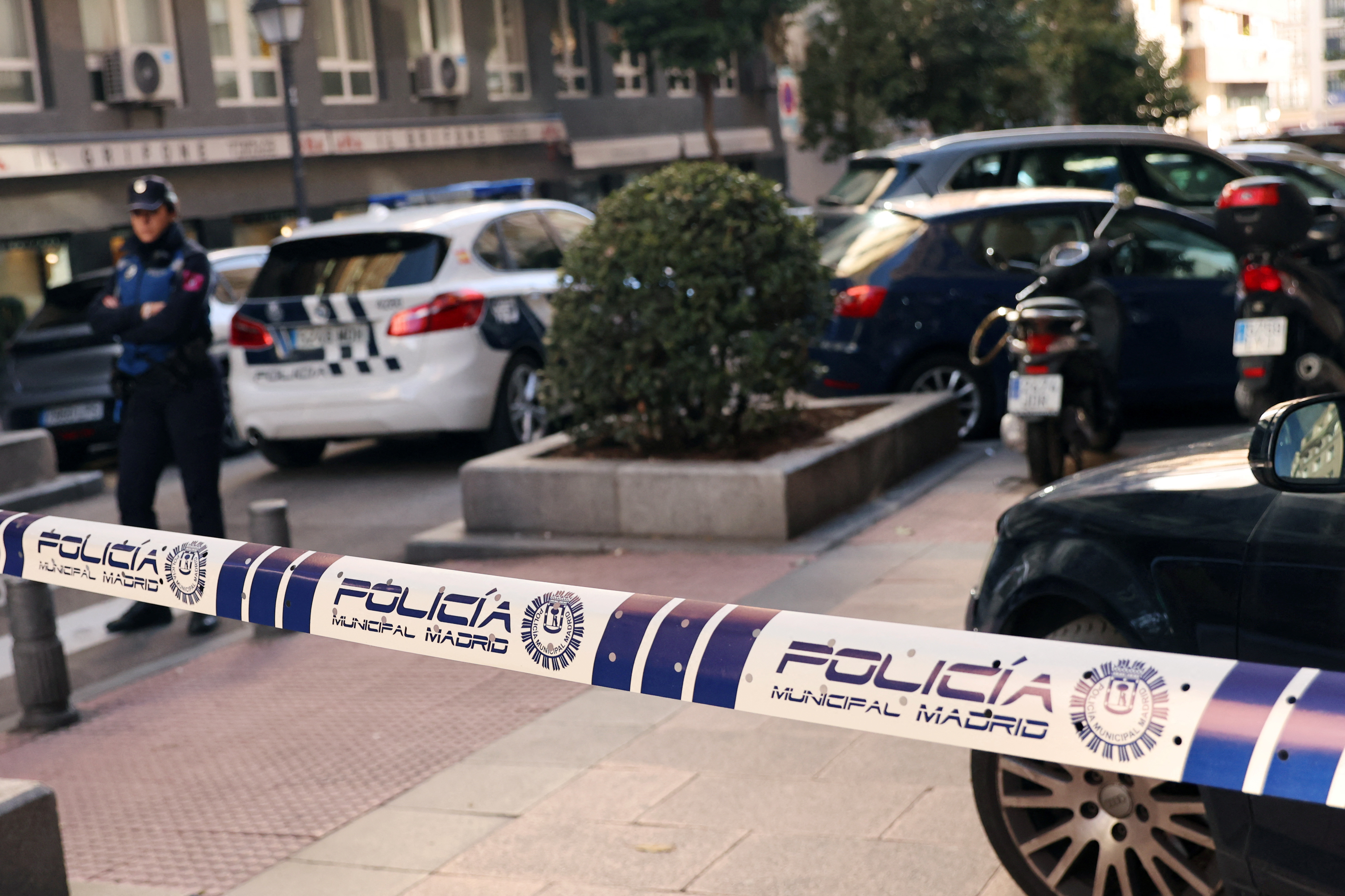 Police work at the site where Alejo Vidal-Quadras, former head of Spain's People's Party in the Catalonia region, was shot in the face, in Madrid